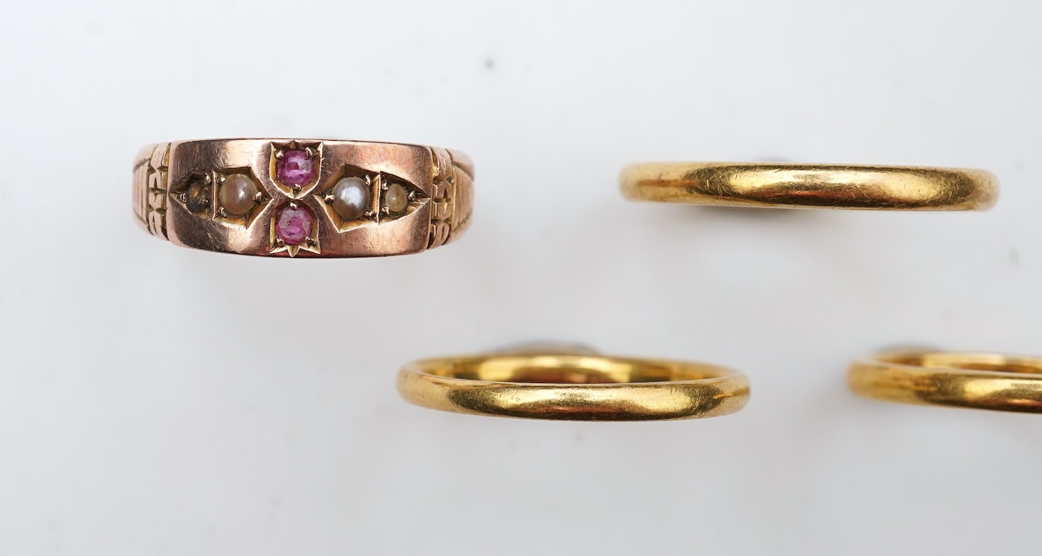 A collection of four gold rings